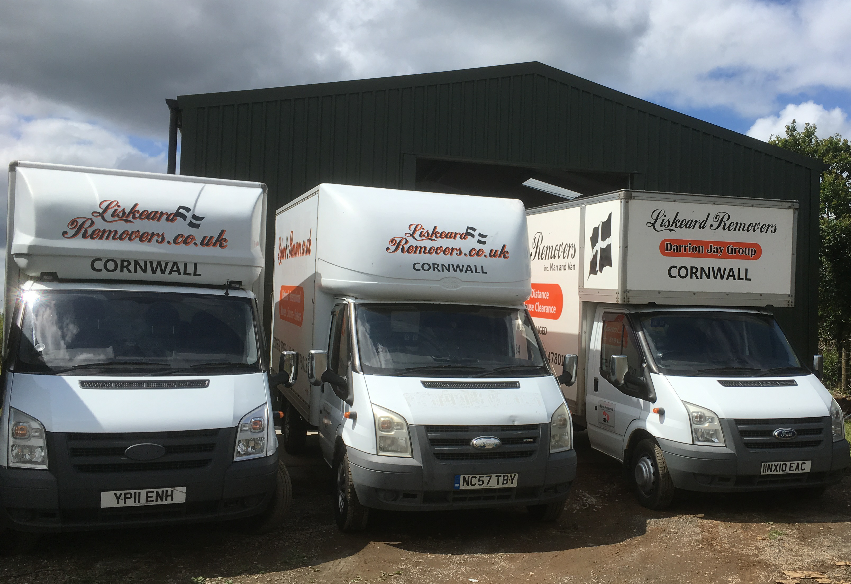 An Image of a line up showing Liskeard Removers vans
